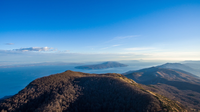 nature, mountains, volcanic crater, non-urban scene, sea, mountain range, cloud - sky, forest, sky, earth day, water, tranquil scene, travel, aerial, summer
