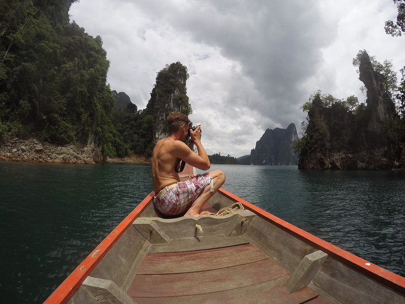 stone, shirtless, tourist, leisure activity, transportation, national park, outdoors, landscape, khao sok, tail, tree, sky, boat, sitting, nautical vessel