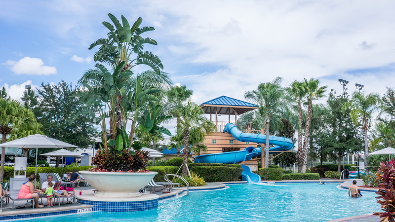 chairs, swimming, holiday, vacations, nature, villa, slide, hotel, incidental people, activity, day, paradise, clouds, area, built structure, entertainment