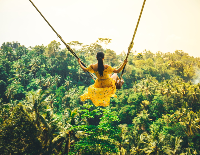 jungle, arms outstretched, excitement, limb, bush, land, one person, freedom, plant, bali, young adult, real people, full length, nature, indonesia, human