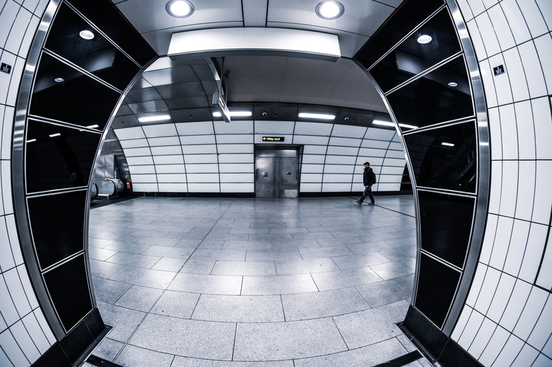 person, architecture, flooring, underground walkway, subway, walking, building, lighting, transportation, indoors, human, the way forward, inside, vehicle
