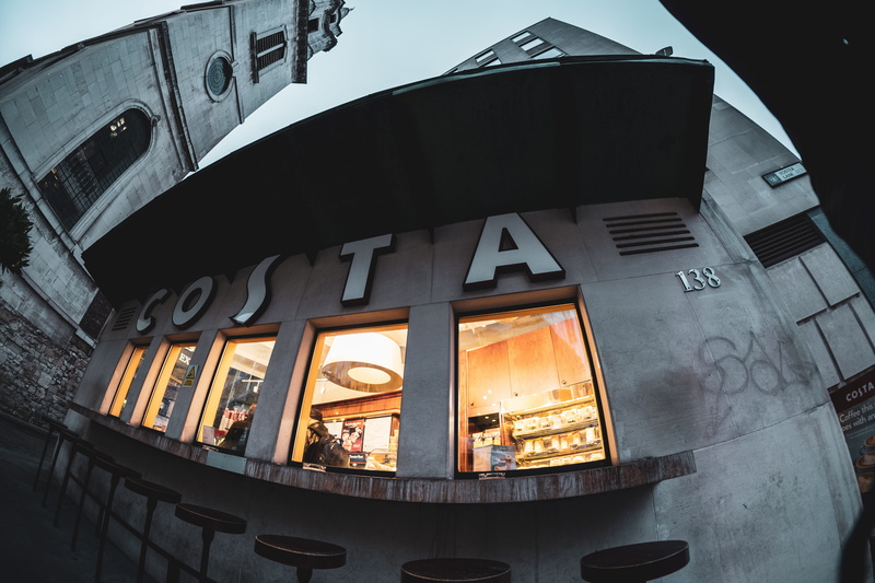 outdoors, pillar, display, architecture, shop, office building, window, low angle view, cafeteria, fisheye, incidental people, cafe coffee, mode of transportation