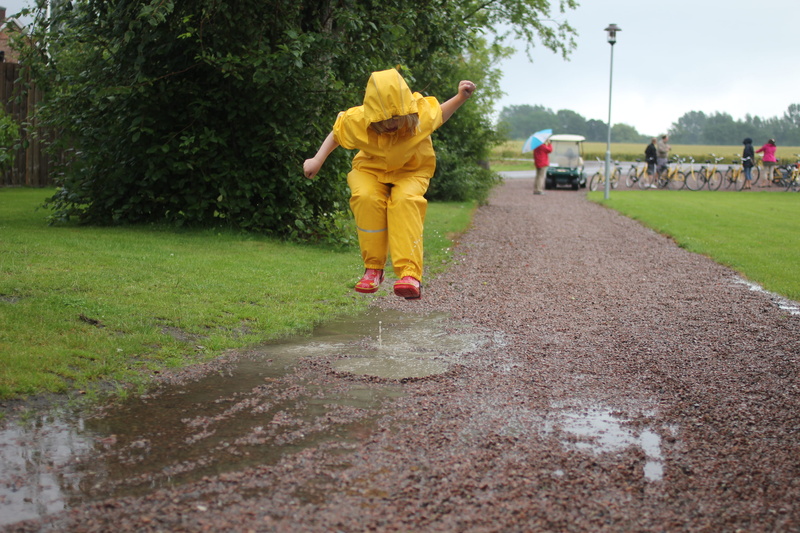 leisure activity, day, rain, full length, yellow, one person, field, casual clothing, lifestyles, real people, tree, grass, child, 2K, childhood, women