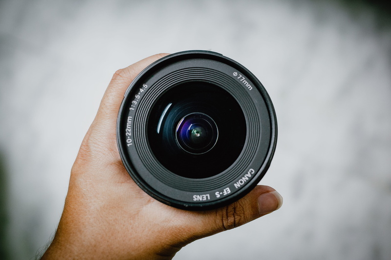 tire, hand, wheel, zipper, focus on foreground, electronics, holding, close-up, person, finger, technology, photographer, digital camera, photographic equipment