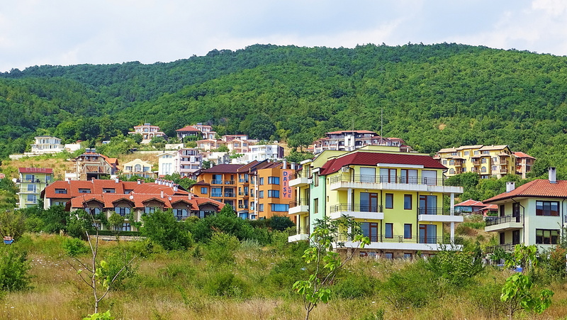 cityscape, rural scene, roof, day, outdoors, land, travel, bulgaria, architecture, landscape, environment, tree, pine tree, house, mountain, no people