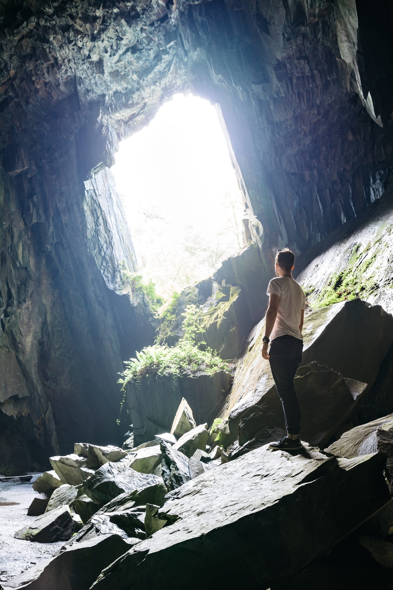 stone, stand, young adult, man, leisure activity, rocks, standing, cave, looking, young men, 4K, day, shadow, real people, casual clothing, rock, rock - object