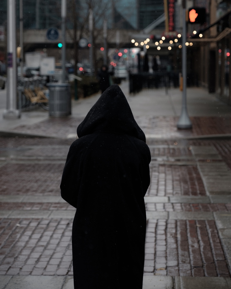 sidewalk, sweater, cap, warm clothing, 4K, light, waist up, apparel, city life, city, overcoat, paving stone, focus on foreground, hood, walkway, hood - clothing
