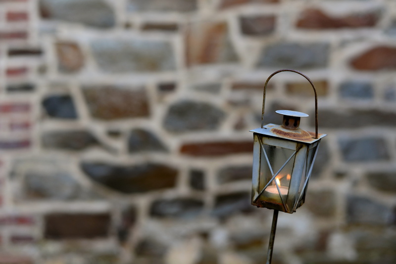 metal, wall - building feature, outdoors, iron, occupation, flame, candle, day, background, focus on foreground, rusted, technology, creativity, building exterior