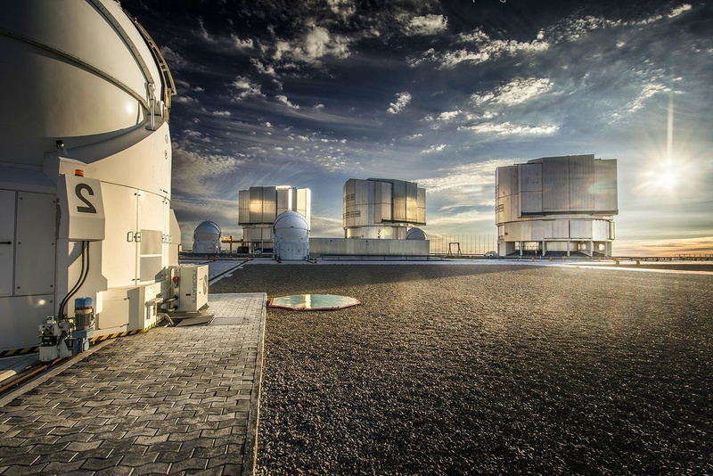 street, outdoors, water, city, built structure, cloud - sky, factory, office building exterior, building exterior, no people, transportation, nature landscape paranal observatory atacama desert sunset technology sunlight clouds astronomy chile