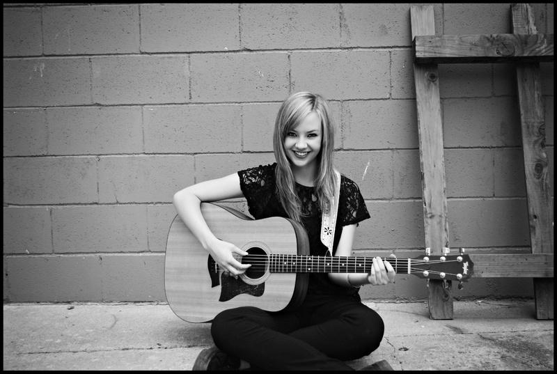 Laura Brehm, wall - building feature, string instrument, 1080P, leisure activity, music, portrait, real people, hair, outdoors, looking at camera, front view