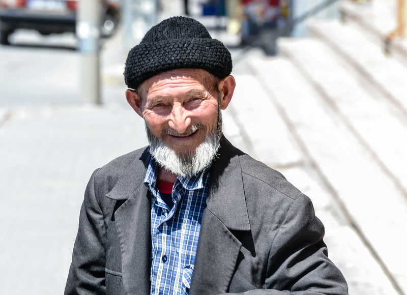 focus on foreground, skullcaps man, walking, Old Man, forlorn, beaver, peaceful, turkey, one man only, full of love, 4K, real people, mature men, lifestyles