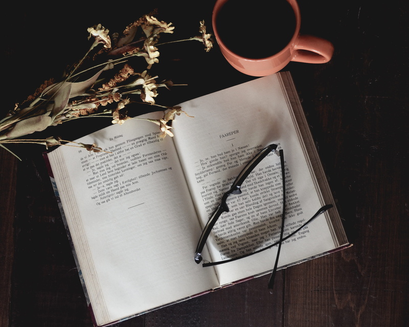 table, mug, text, music, reading glasses, open book, indoors, cup, coffee mug, nature, beverage, dried flowers, black, pink, directly above, still life