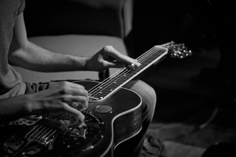 human body part, black and white, musical instrument, string instrument, rock music, guitar, hand, slide, one person, artist, musician, adult, performance