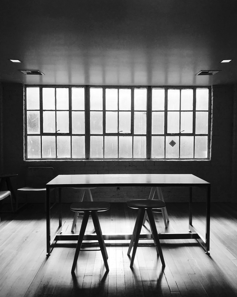 furniture, table, bandw, chair, cafe, architecture, glass - material, empty, flooring, indoors, absence, home interior, day, beverly hills, no people, coffee shop