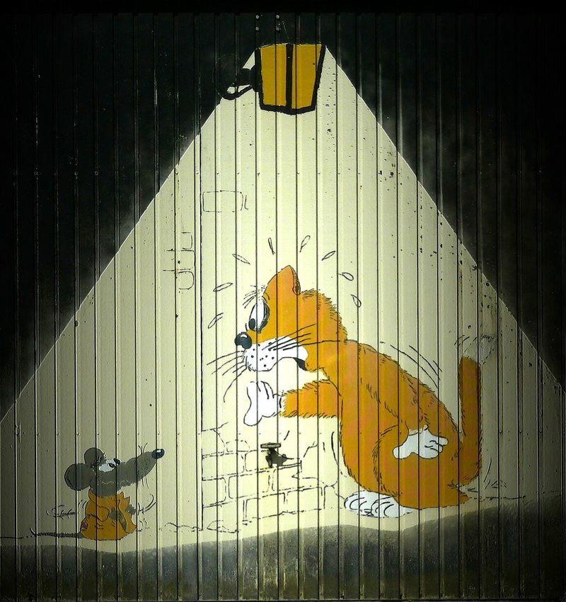 drawing, representation, pattern, animal, shadow, wall - building feature, human representation, garage door, image, sunlight, day, nature, musical instrument