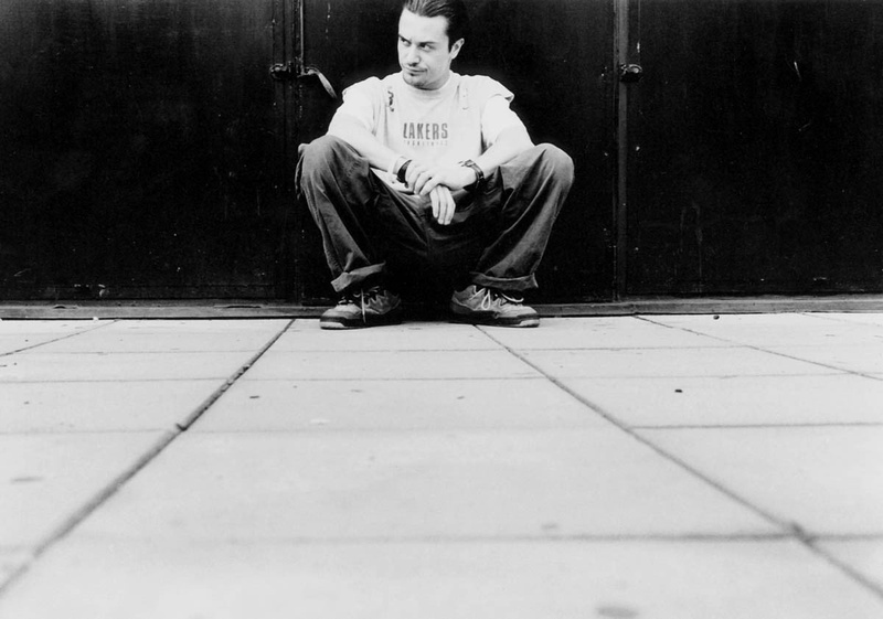 Mike Patton, front view, lifestyles, looking at camera, men, real people, cross-legged, sitting, tiled floor, leisure activity, portrait, contemplation