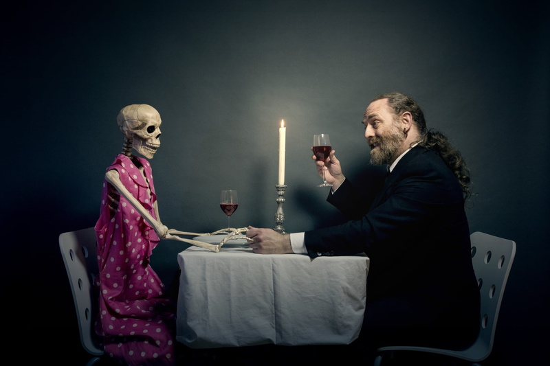 s, side view, women, people, studio shot, indoors, skeleton, lighting equipment, clothing, mature men, black background, formalwear, two people, well-dressed