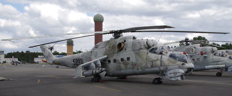 mode of transportation, road, air vehicle, war relic, sky, cockpit, aerospace industry, stationary, government, helicopter, army, aircraft, day, arrival