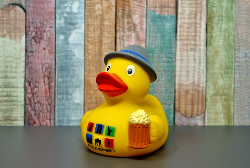 toy, cute, indoors, year market, figurine, wood - material, table, fun, still life, representation, surface, single object, gray, hat, close-up, toy duck