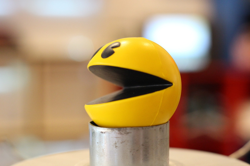 5K, simplicity, domestic room, domestic kitchen, retro, indoors, pac man, close-up, day, focus on foreground, arcade game, classic, yellow, selective focus