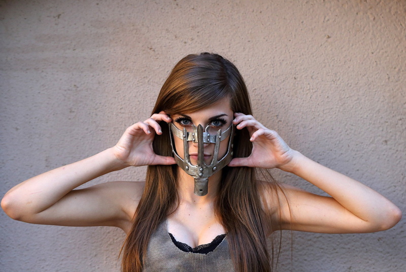 real people, sleeveless, hair, looking at camera, leisure activity, holding, cosplay, headshot, young adult, long hair, lifestyles, beautiful woman, human face