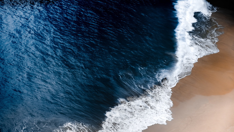 sea, aquatic sport, surfing, beauty in nature, wind wave, breaking, ocean, scenics - nature, rock, high angle view, land, sport, 4K, beach, blue, water