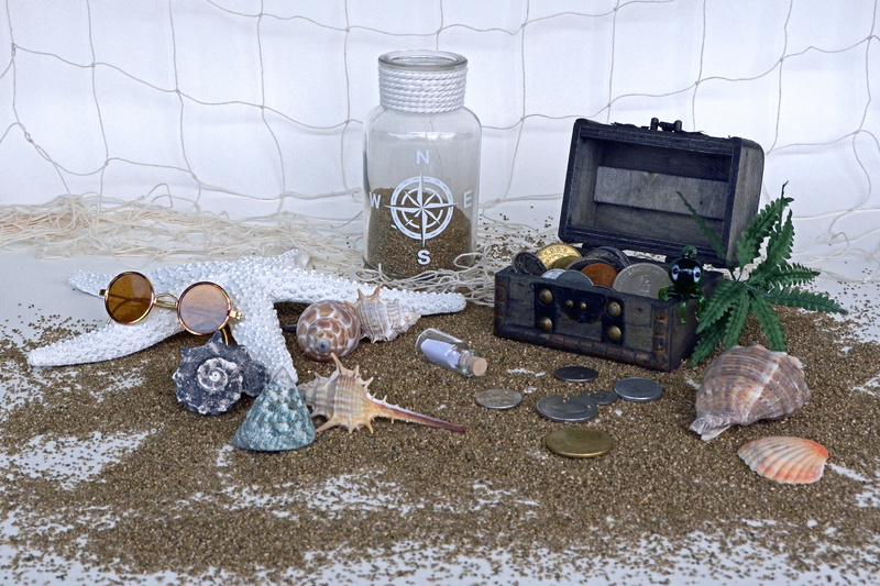 still life, travel, black, starfish, indoors, open, loose change, christmas ornament, currencies, coins, treasure, money, antique, metal, points of the compass