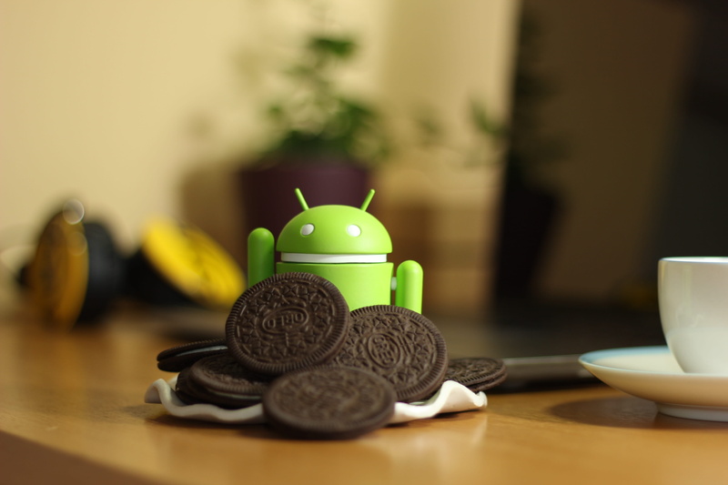 tea cup, android, oreo, beside, crockery, wood - material, stack, indoors, food and drink, food, toy, currency, table, still life, representation, no people