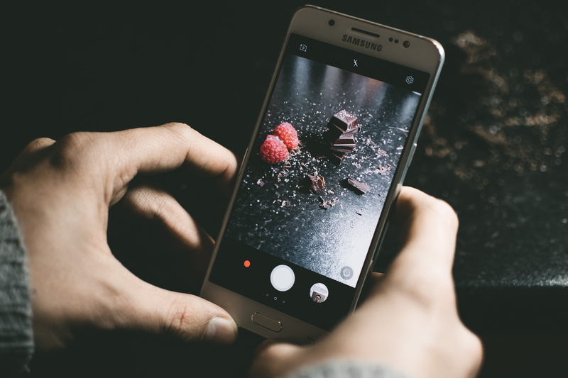 cell phone, touch, picture, samsung, lifestyles, close-up, portable, outdoors, chocolate, finger, taking picture, using phone, hand, human body part, chocolates