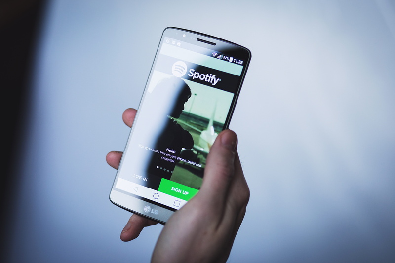 smartphone, mobile app, communication, cell phone, mobile, connection, telephone, person, blue background, portable information device, spotify, computer network