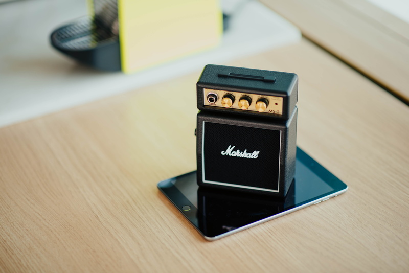 focus on foreground, amplifier, equipment, table, marshall, black, single object, mobile phone, portable information device, modern, mobile, close-up, day