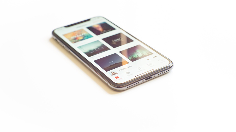 wireless technology, phone display, music, applications, copy space, healthcare and medicine, turned, minimal, still life, object, mobile app, screen, cut out
