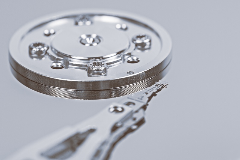 memory chip, computer equipment, hardware, metal, repair, selective focus, stylus, circle, shape, white background, round, indoors, clean, gray, backgrounds