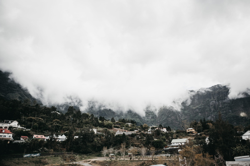 building, réunion, tree, mountain, trees, scenics - nature, residential district, architecture, sky, landscape, outdoors, plant, beauty in nature, desaturated