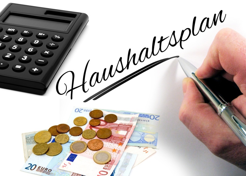indoors, savings, calculator, finance, currency, text, beside, coins, wealth, person, people, human finger, business, human body part, coin, count, hand