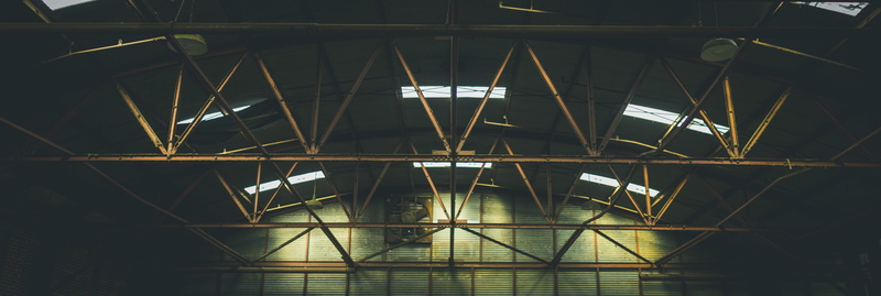 airport, lighting equipment, empty, vintage, indoors, full frame, steel, low angle view, connection, rafters, architecture, no people, industry, supports