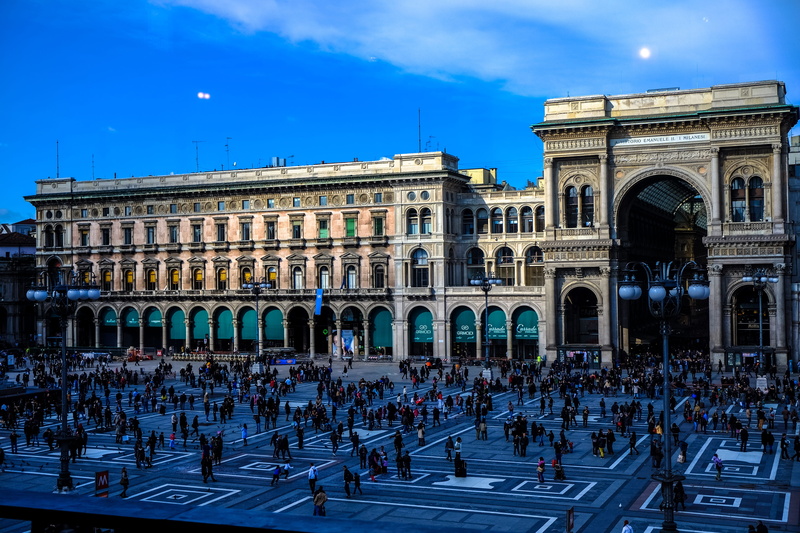 women, people, galleria vittorio emanuele ii, building, city, italy, outdoors, built structure, blue, day, group of people, sky, building exterior, arch