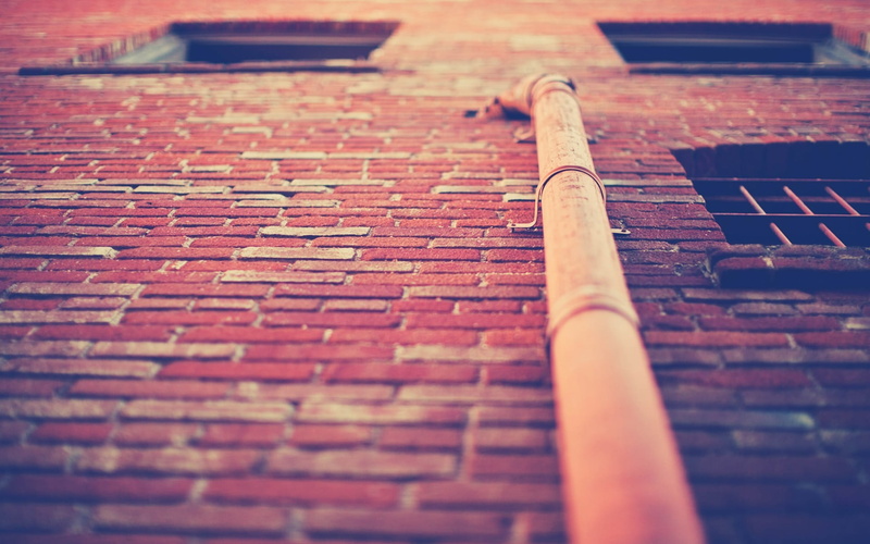 wall, paving stone, metal, warm colors, street, pipe, selective focus, architecture, day, window, close-up, building, brown, brick, bricks, city, textured