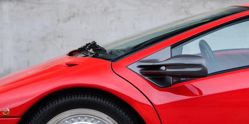 fuel and power generation, day, car, close-up, motion, side view, mode of transportation, Lamborghini Diablo, focus on foreground, stationary, reflection