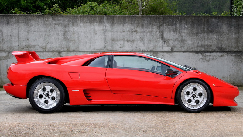 side view, red, car, 1080P, stationary, garage, mode of transportation, land vehicle, motor vehicle, retro styled, shiny, transportation, outdoors, wealth