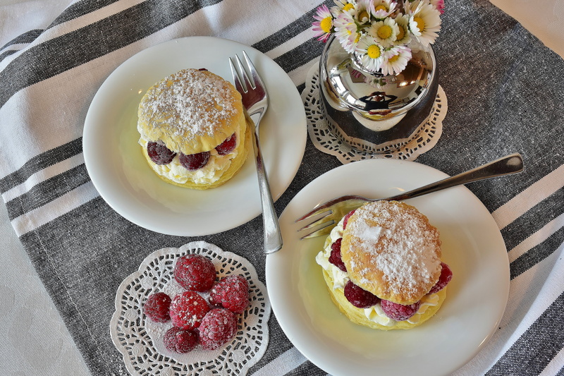 puff pastry, plate, flour, day, table knife, sweet food, table, plates, bake, eat, food, egg, indoors, delicious, breakfast, red, close-up, eating utensil