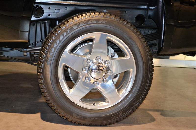 goodyear tire, road, motor vehicle, light, vehicle part, mode of transportation, city, modern, car, design, no people, close-up, 2K, shopping, luxury