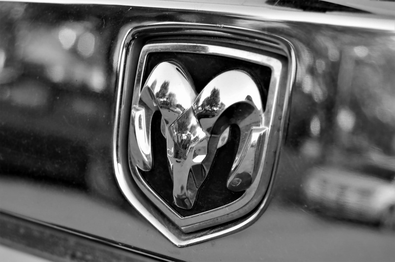 focus on foreground, mode of transportation, car door, retro styled, trunk, no people, headlight, outdoors, 2K, mirror, motor vehicle, emblem, day, close-up