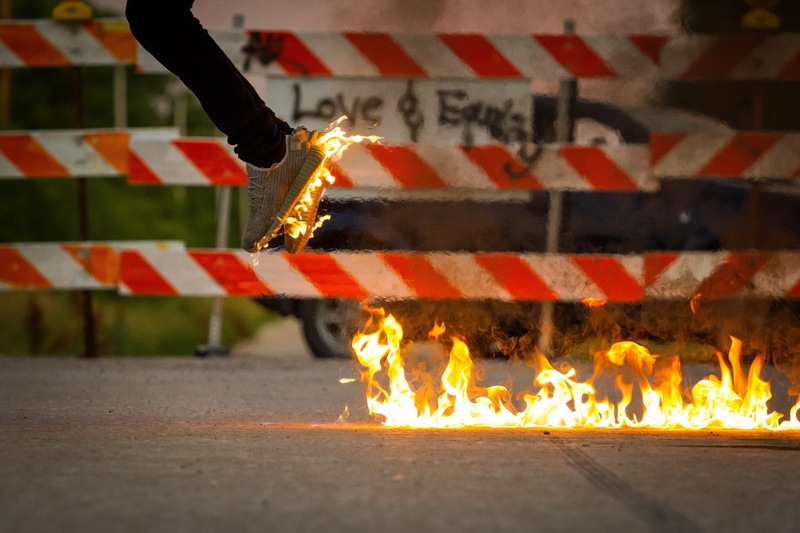human hand, fire - natural phenomenon, one person, jumping, street, sign, adida, caution, danger, cool, barricade, nature, adventure
