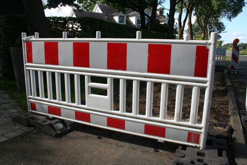 white color, mode of transportation, plant, field, barricade, nature, site, fence, tree, bake, land vehicle, transportation, construction fence, red white