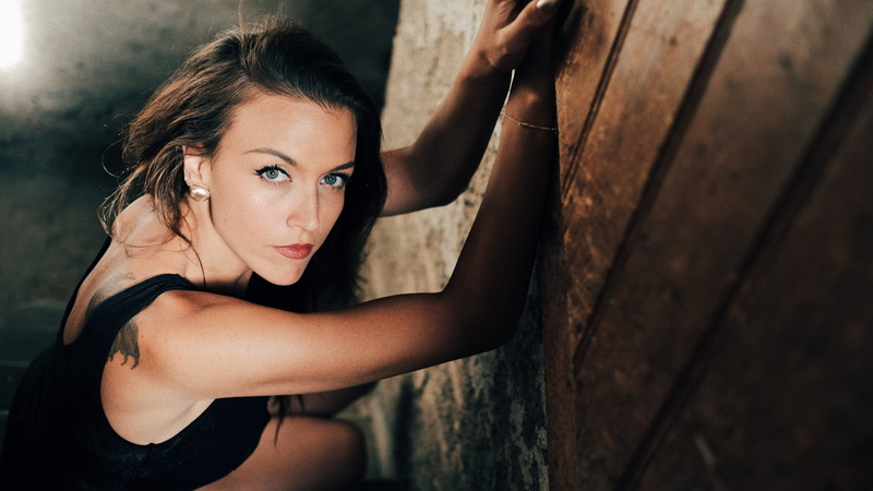 wall - building feature, young adult, selective focus, tattoo, beautiful woman, one person, young women, lifestyles, focus on foreground, adult, wood - material