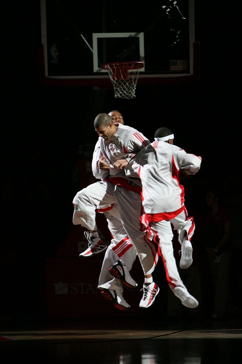 stage, adult, males, two people, child, backboard, jumping, game, athlete, team, performance, traditional clothing, action, players, dunk, sport, active