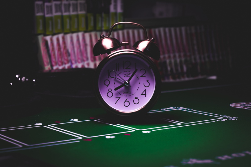 technology, watch, alarm, table, still life, green, gambling, leisure games, indoors, communication, green color, lights, number, night, bell, twin, purple