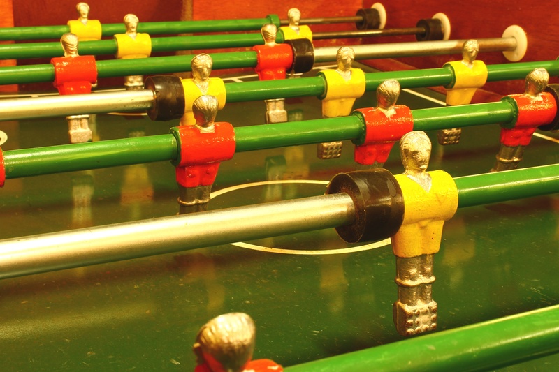 in a row, competition, fun, figurine, indoors, family game, no people, leisure games, football, game, human representation, male likeness, high angle view