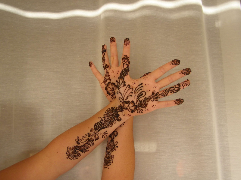 one person, real people, adult, hand, tattoo, human hand, human limb, indoors, lifestyles, henna, pattern, body part, human body part, art and craft, human finger